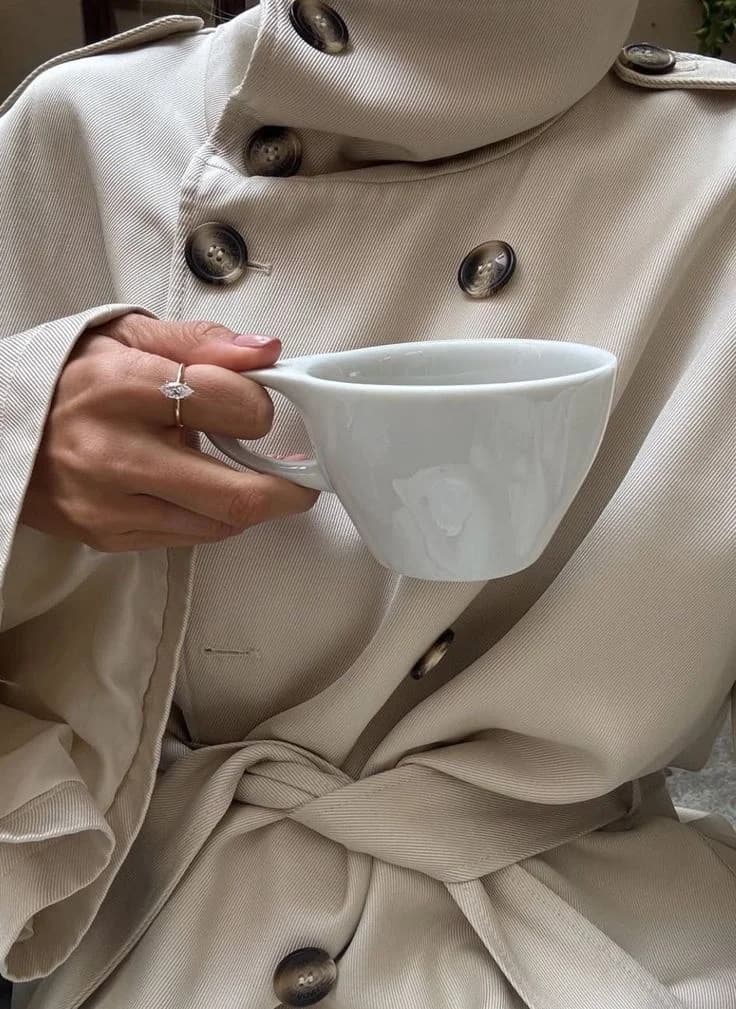 A quiet coffee break in a cream coat